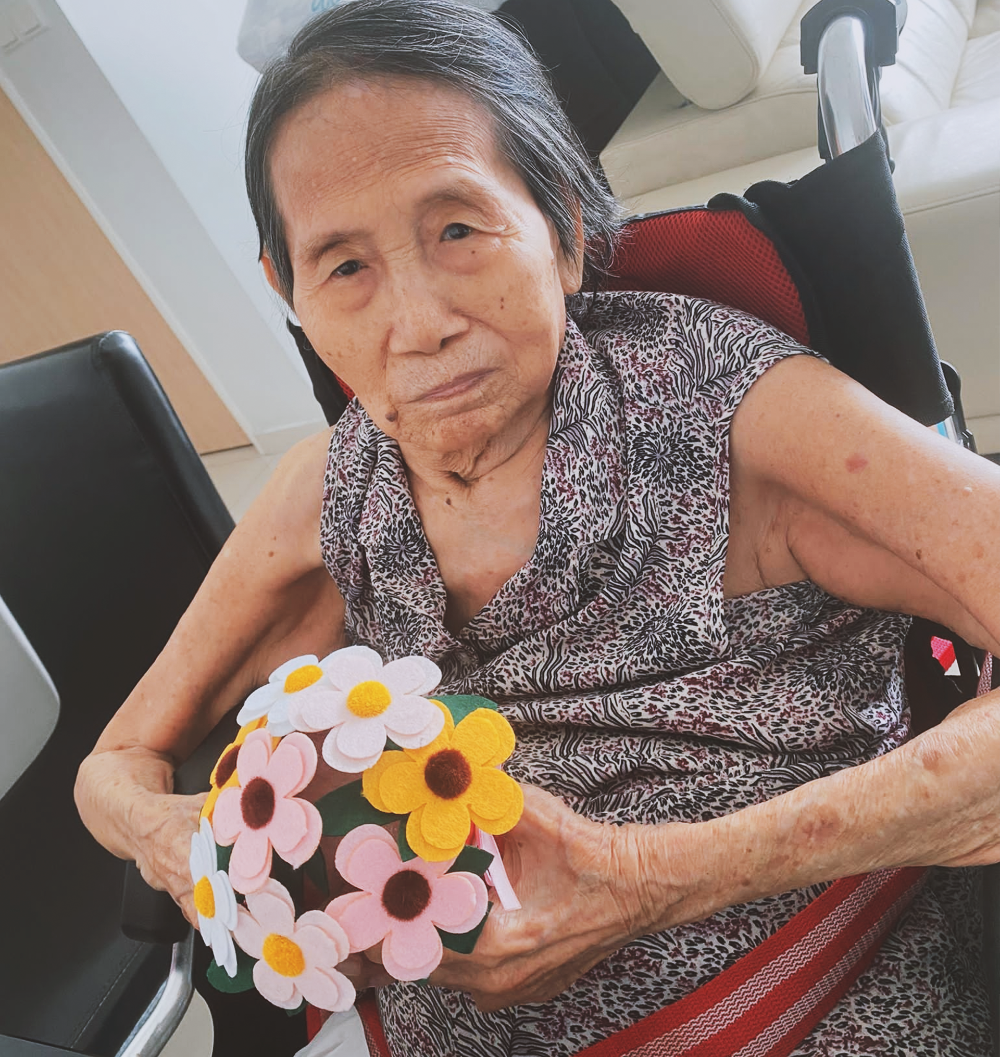 Mdm Lim with her completed bouquet