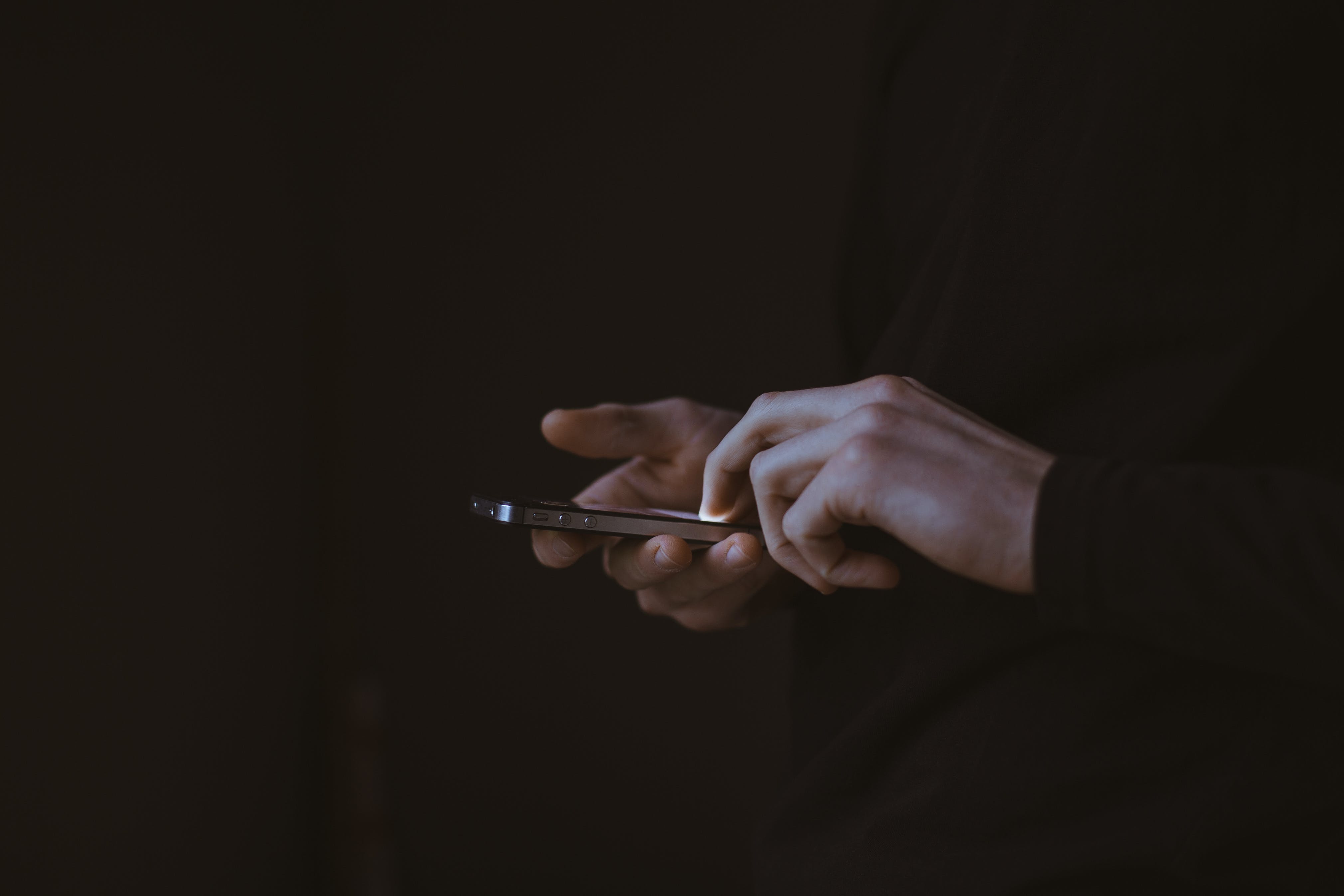 A person uses their mobile phone for digital banking. 