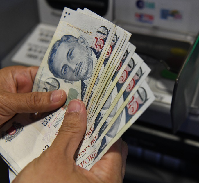 The Singapore dollar is set to weaken further