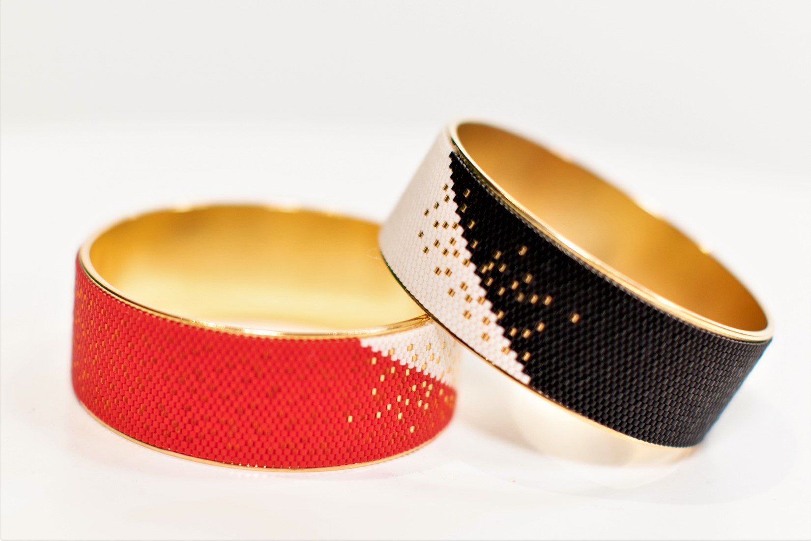 A pair of handmade beaded bangles by Eden+Elie